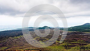 Low cloudy sky over lava fields on Mount Etna