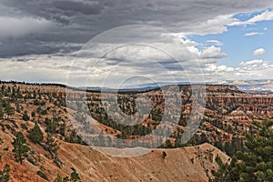 Low, dark storm clouds begin to gather over Bryce Canyon