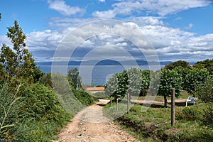 A low dirt road towards the sea on the Island of Ons in Galicia, Spain photo