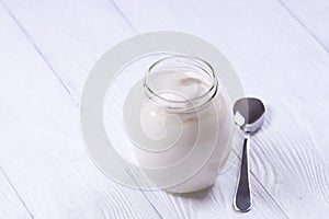 Low-fat yogurt in a glass jar.