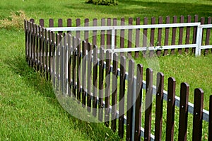 Low fence, as protection against dogs. protects the playground from uninvited guests. The fence planks are made of recycled plasti