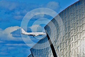 Low flying airplane over the thames barriers