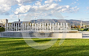 Low fountain water jets in University Park in a sunny day, Zagreb, Croatia