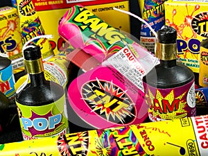 Low Grade hand held fireworks like Pop Its and Party Poppers on a black backdrop