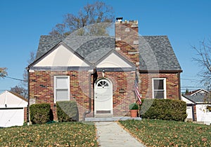 Low Income Brown Brick House with Arched Door