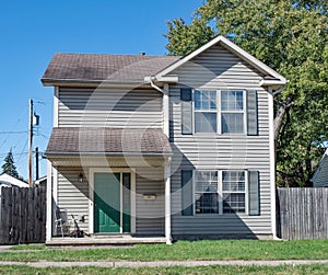 Low Income House with Green Door photo