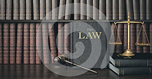 Low key filter law bookshelf with wooden judge`s gavel and golden scale