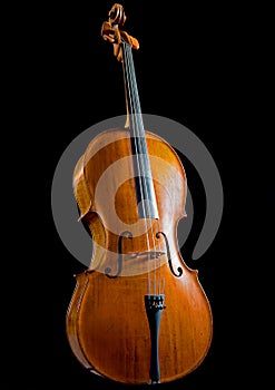 Low key image of an antique cello