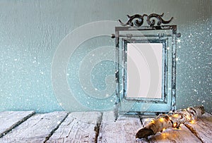 Low key image of old victorian steel blue blank frame