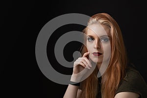 Low key portrait of attractive young woman