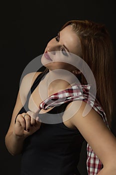 Low key portrait of posing dreamy young woman