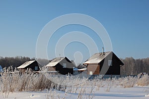 Low-rise houses cottages in the winter in the village brought snow recreation center