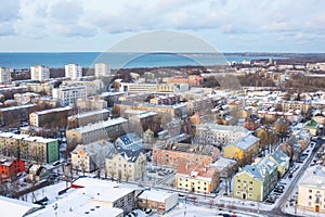 Low-rise residential area and and sea bay on the horizon