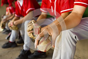 Low Section Of Baseball Team Mates Sitting In Dugout