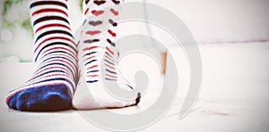 Low section of girl wearing patterned socks