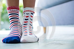 Low section of girl wearing patterned socks