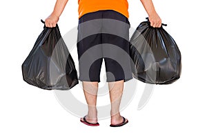 Low section of young man carrying garbage bags isolated on white