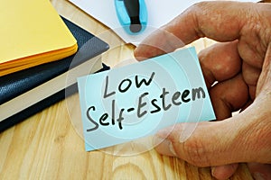 Low Self esteem sign in the hand photo