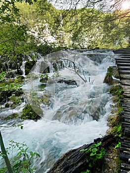 Low shutter speed of beautiful waterfalls, Plitvice lakes national park UNESCO, dramatic unusual scenic, green foliage alpine