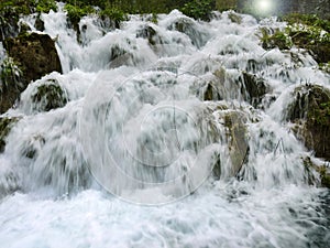 Low shutter speed of beautiful waterfalls, Plitvice lakes national park UNESCO, dramatic unusual scenic, green foliage alpine