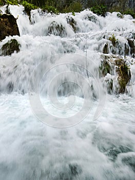 Low shutter speed of beautiful waterfalls, Plitvice lakes national park UNESCO, dramatic unusual scenic, green foliage alpine