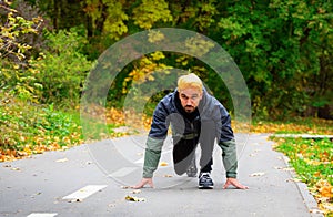 Low start runner prepares to run