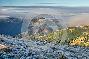 Low Tatras mountain ridge under mist during autumn, view from Skalka mountain