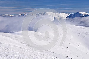 Low Tatras mountains ridge during winter and inversion mist in the valley