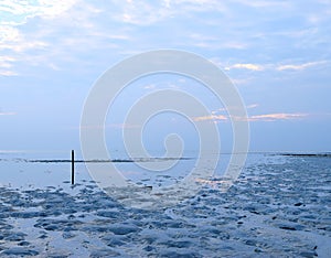 Low Tide at Beach - Infinity at Horizon and Cloudy Sky at Dawn - Peace, Stillness, and Tranquility photo