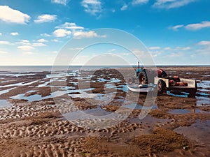 Low tide beach sun holiday Hunstanton farming tractor seafood mussels view rustic boat sand blue