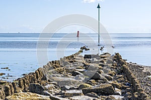 During low tide, these breakwaters become visible along the south side of the island of Vlieland