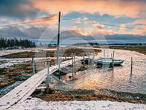 Low tide. Fishing pier in the authentic Northern village of Umba. Kola Peninsula, Russia