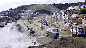 Low tide at the harbour leaving the boats hit and dry