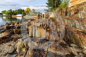 Low tide showing rugged rocks and ledges along the coast of Maine in the morning light