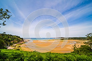 Low Tide and Streaming Water in Golden Sand Beach in Sable d`Or on a Sunny Day in Bretagne France