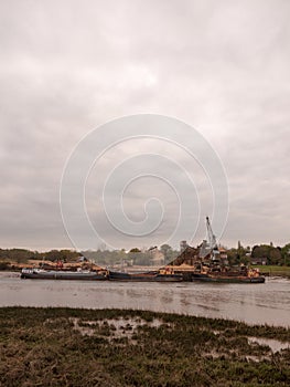 Low tide summer sky nightfall grey clouds mood and reds with riv