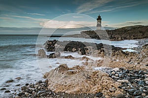 Low tide at the Trwyn Du lighhouse at Penmon Point in Anglesey.