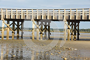 Low Tide With a Wood Bridge Over Bay