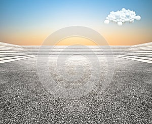 Low view curved step building terrace with wide unmanned asphalt floor, with balloon cloud sky background.