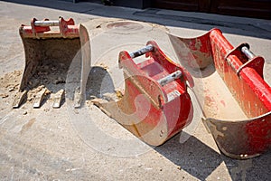 Low view on excavator\'s buckets, various types, different sizes and purpose
