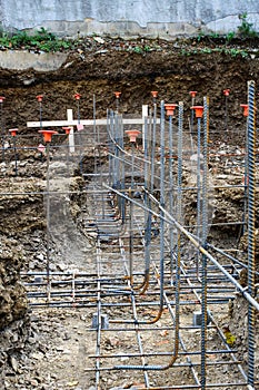 Low view of lines of steel rebar in unpoured footings