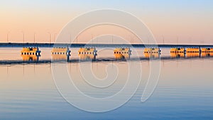 Low water bridge from Sedanka to the De Friz peninsula across the Amur Bay of Primorsky Krai Russia against the background of a