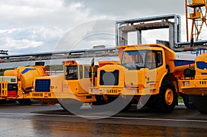 Low yellow dump truck for transportation of rock mass and minerals in underground workings, tunnels and other cramped conditions