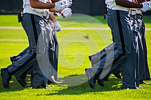 Lower body view of the gray uniform pants of Army cadets as they march. photo