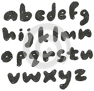 Lower case hand drawn blackened alphabet