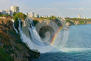 Lower Duden Waterfall in Antalya, Turkey. A beautiful landscape of waterfall, rainbow, sea and city