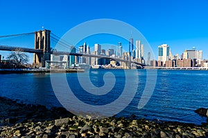 Lower Manhattan Downtown skyline panorama from Brooklyn Bridge Park riverbank, New York City, USA