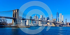 Lower Manhattan Downtown skyline panorama from Brooklyn Bridge Park riverbank, New York City, USA