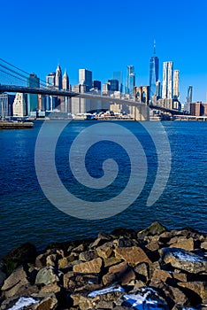 Lower Manhattan Downtown skyline panorama from Brooklyn Bridge Park riverbank, New York City, USA