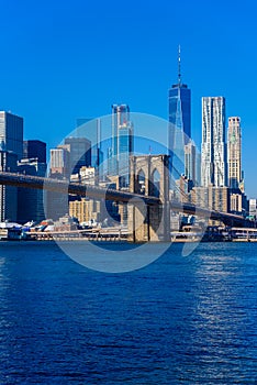 Lower Manhattan Downtown skyline panorama from Brooklyn Bridge Park riverbank, New York City, USA